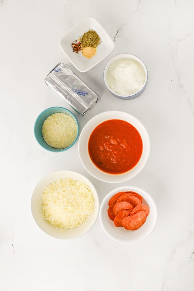 overhead shot of pepperoni pizza dip ingredients