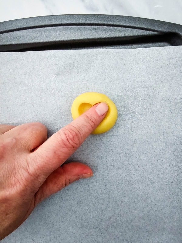 press heart shape into cookie dough ball with tip of finger or thumb