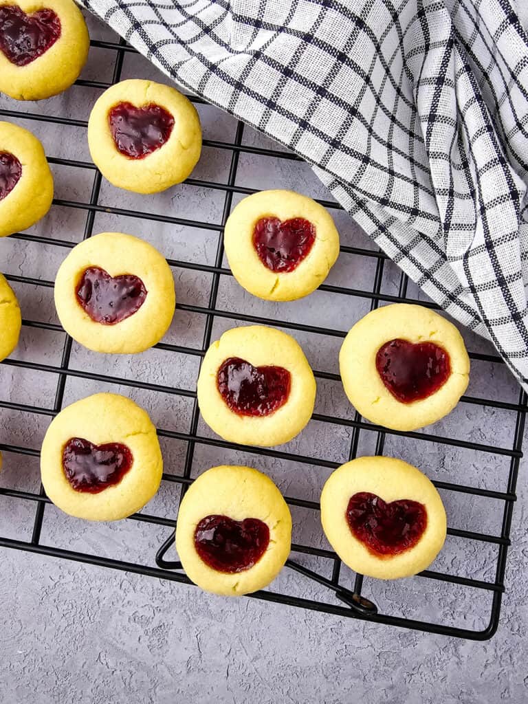 heart thumbprint jam cookies on a cooling rack