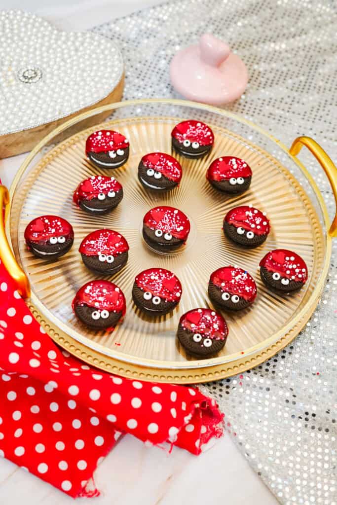closeup of ladybug oreo treats on a tray