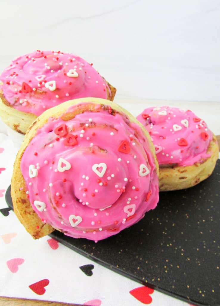 closeup of valentine's day cinnamon rolls on a counter