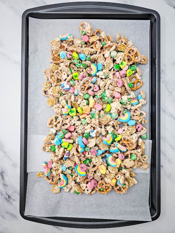 spread snack mix on baking sheet and add extra marshmallows to the top