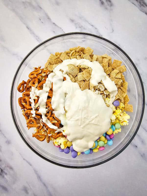 add melted candy and mix well