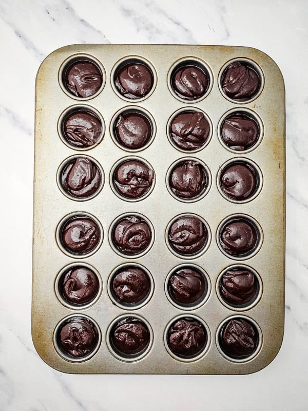 brownie mixture in mini muffin pan