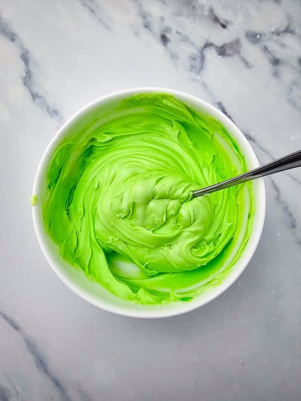 bright green frosting in a bowl